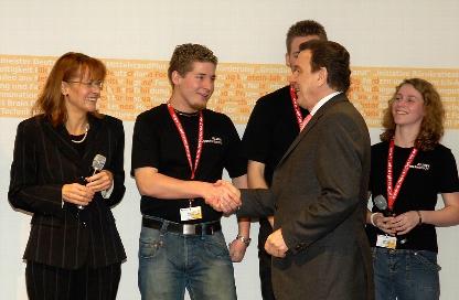 German Chancellor Gerhard Schröder congratulates Moritz, Benedikt and Meike on becoming national champions at CeBIT (source: The Press and Information Office of the Federal Government)