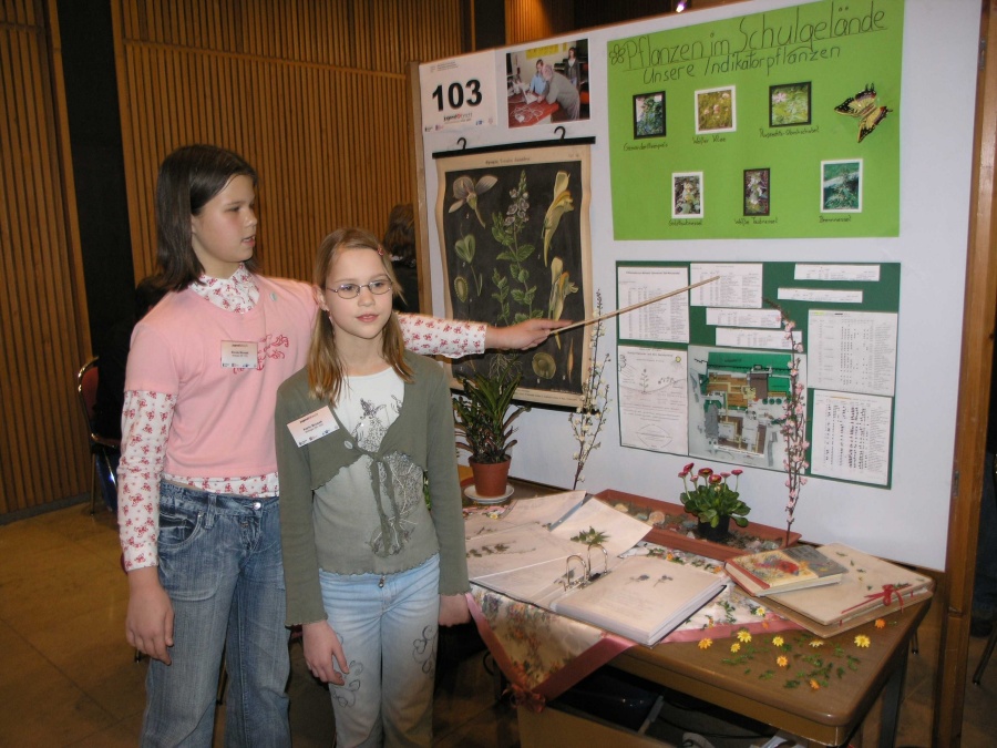 Nicole Mrosek and Karin Mrosek report their findings at the regional competition