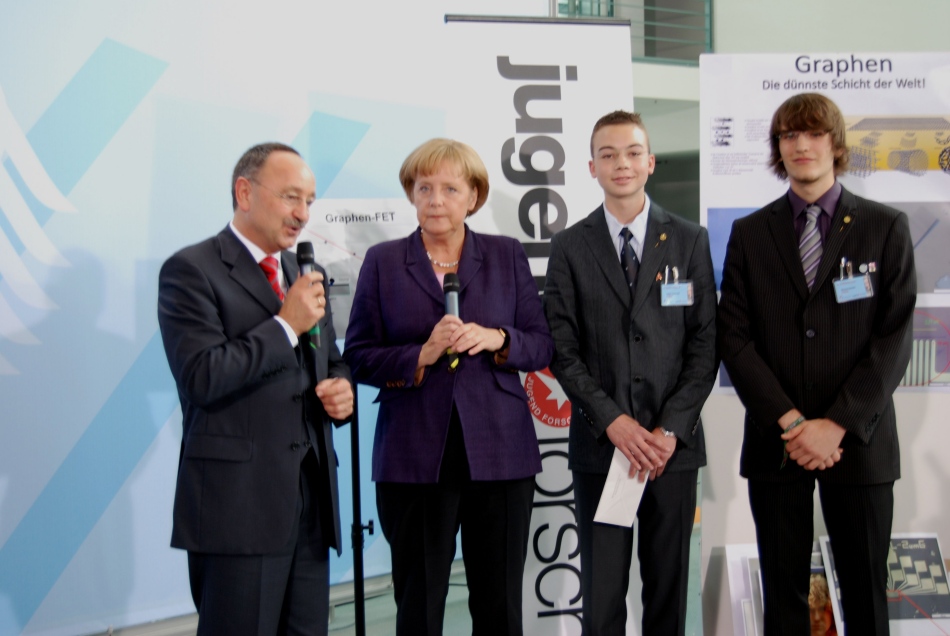 Walter Stein, German Chancellor Angela Merkel, Tobias Kaufmann and Michael Schmitz speak to the press