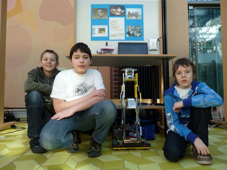 Matthias Schäfers, Laurenz Walkowsky and Adrian Lenkeit with their robot at the regional contest
