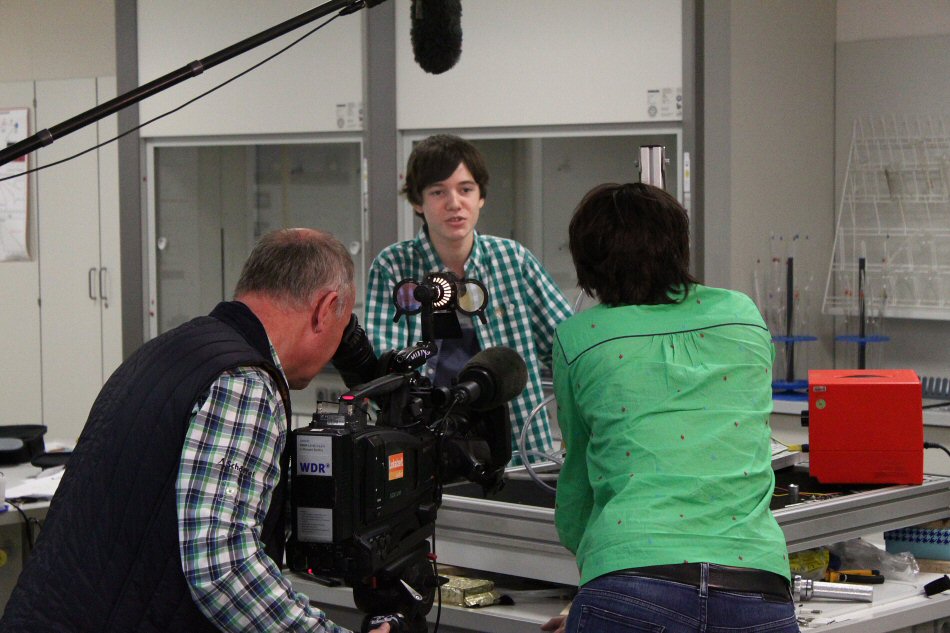 Adrian explains to the WDR TV crew why he enjoys research